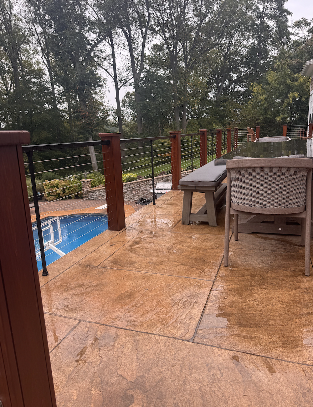 Stamped concrete front porch with RDI Elevation aluminum railings in Desert Tan Ashlar Slate in West Deptford NJ by Patrick Breen