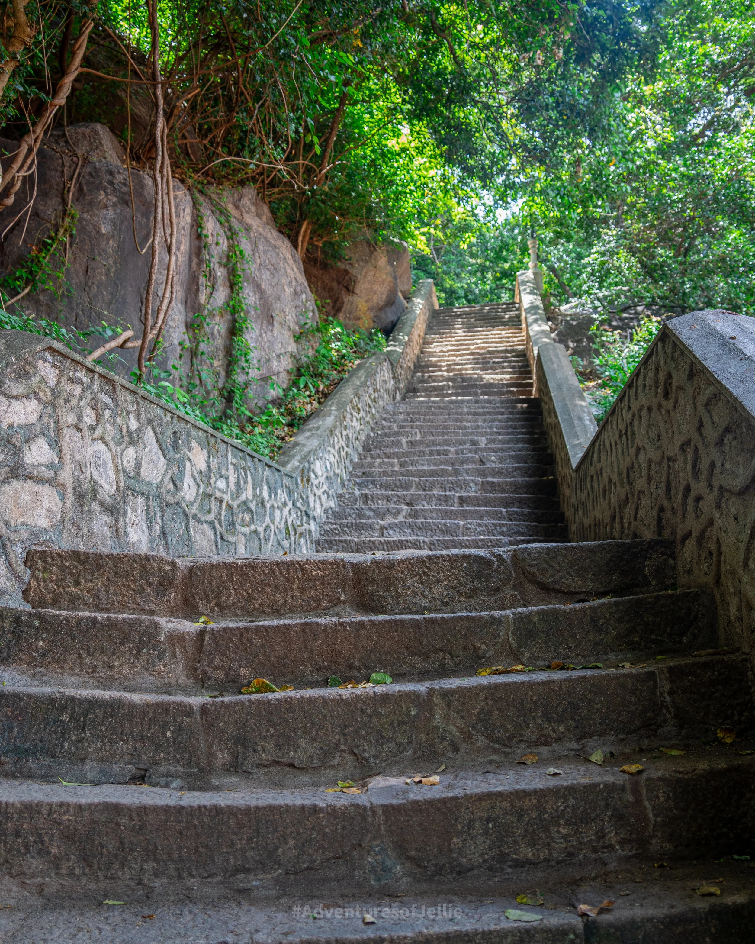 A steep staircase leading up to the Dambulla Royal Cave Temple