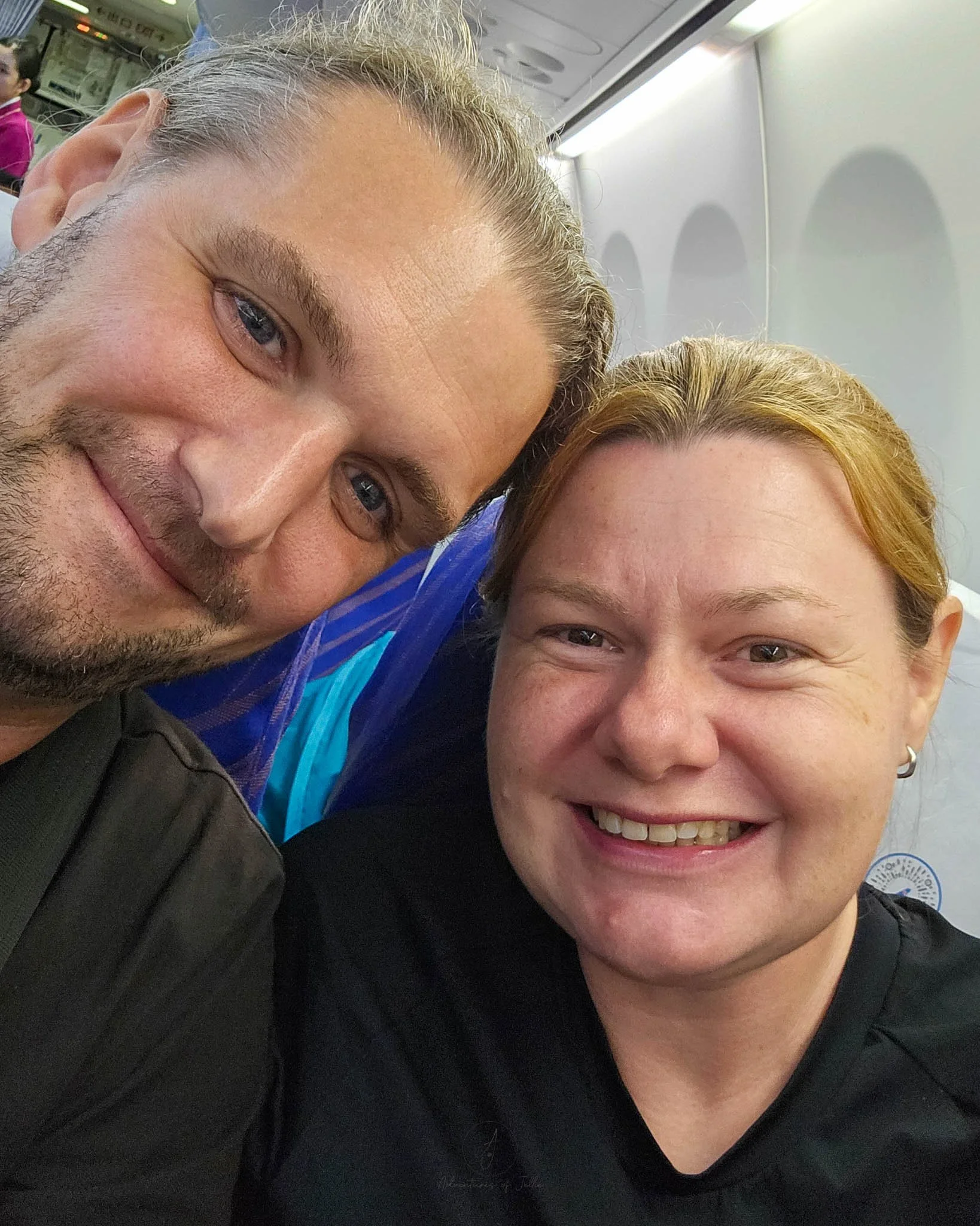 Adventures of Jellie smile for a selfie whilst sitting on a China Southern aeroplane.