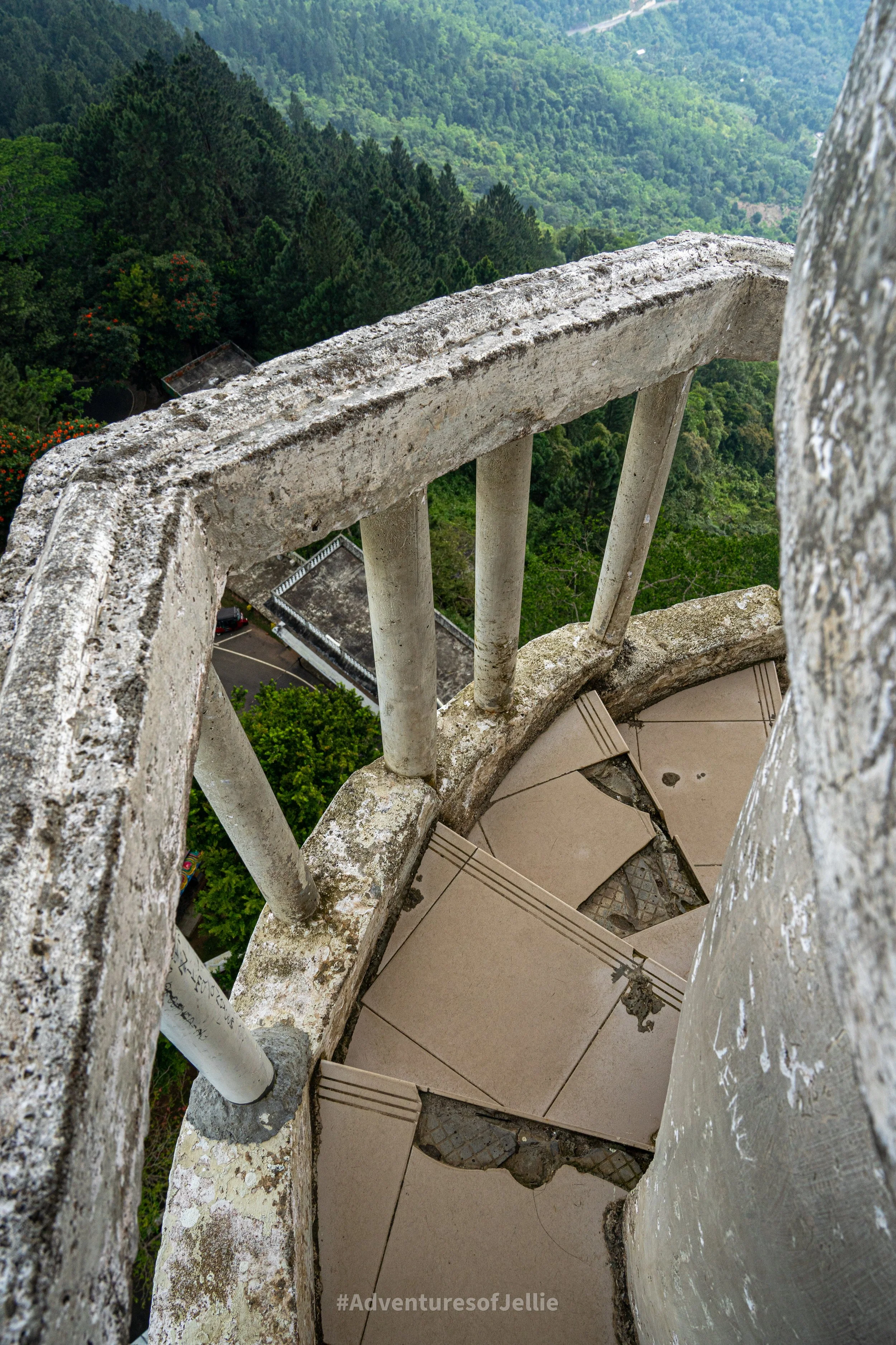 The cracked tiles and uneven steps leading to the top of the Ambuluwawa Tower in Gampola Sri Lanka.