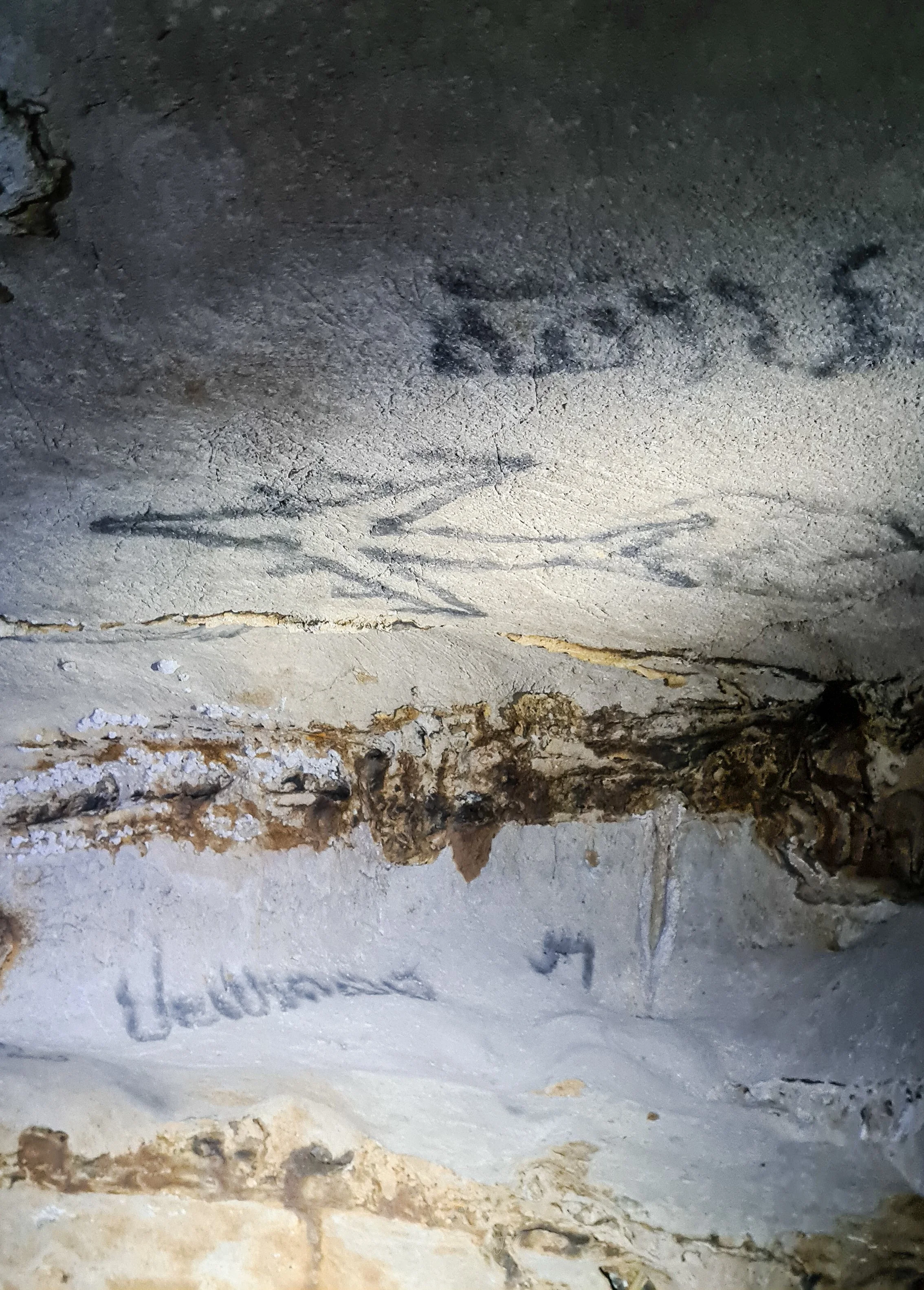 The walls of the Phar Noi History Caves are painted with war time graffiti including a picture of a B52 bomber in Nong Khiaw, Laos.