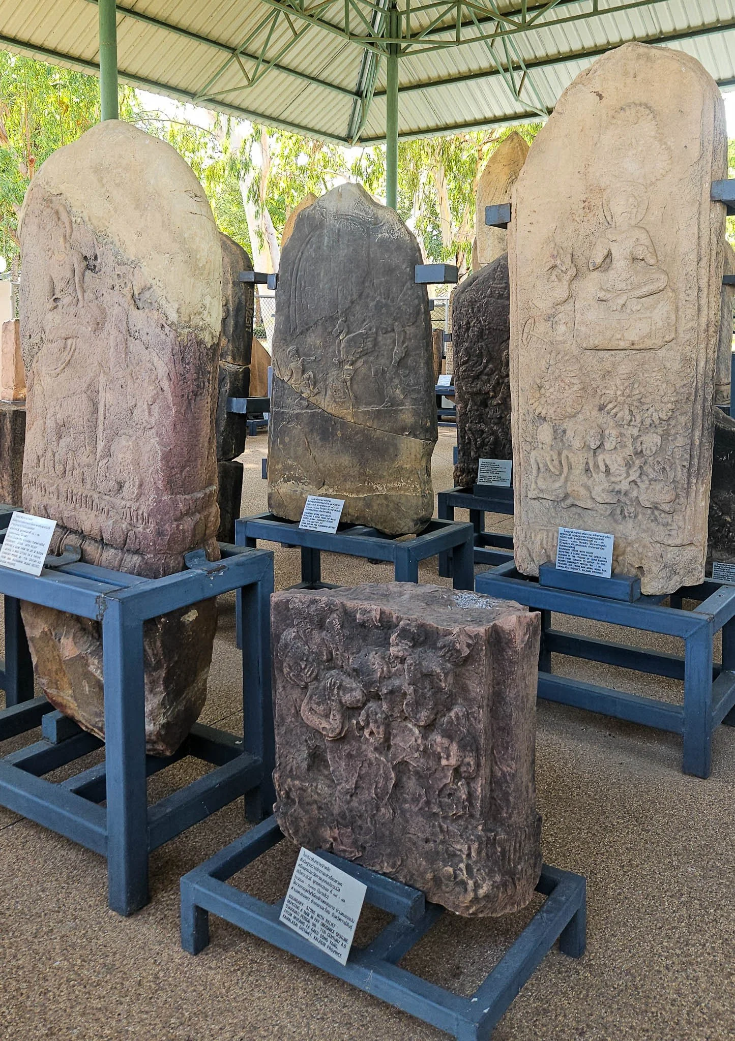 Carved stone border stones sit displayed in the grounds of the Khon Kaen National Museum.