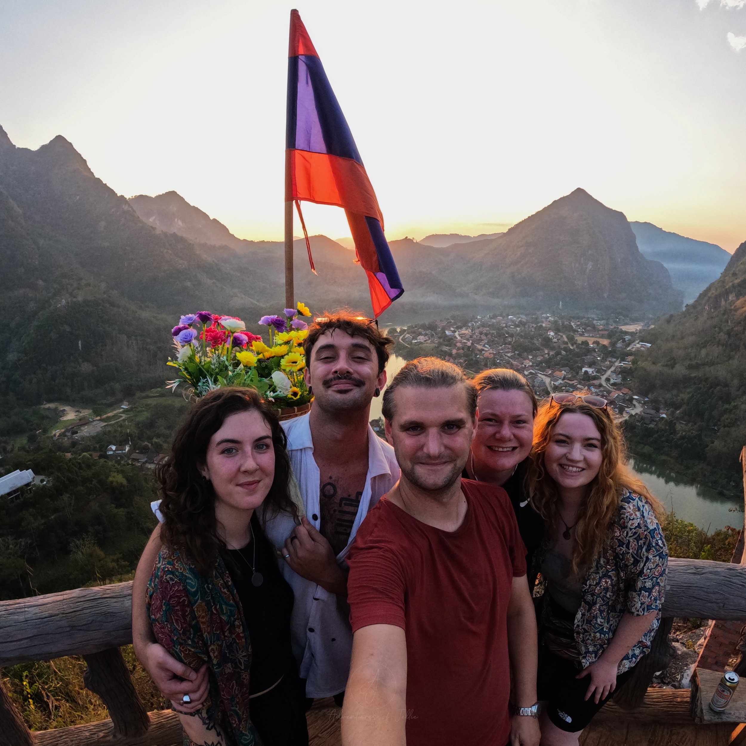 Jellie pose for a selfie with a group of friends at the top of the Som Nang Viewpoint in Nong Khiaw.