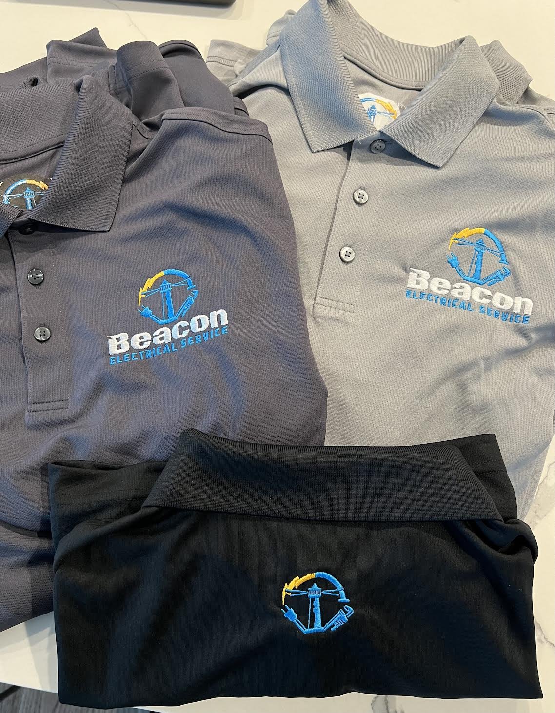 Customer Golf Polos Embroidered for Beacon Electrical