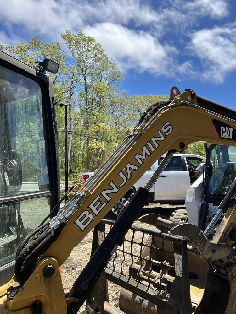 Why leave machinery at a job site without advertising your business!? Quick and easy white vinyl lettering for our customers Excavator out of Swansea, MA.