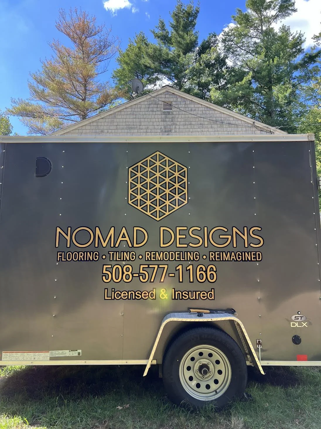 Premium Gold Metallic Vinyl and black outline for this classy display on all 3 sides of this enclosed trailer for Nomad Designs