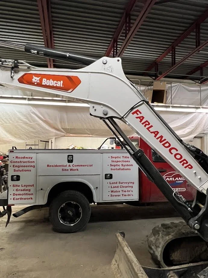 Cool looking image of both jobs we completed one early morning. Utility Truck fully lettered with business focal points, primarily used at job site visualization and the Bob Cat Arm.