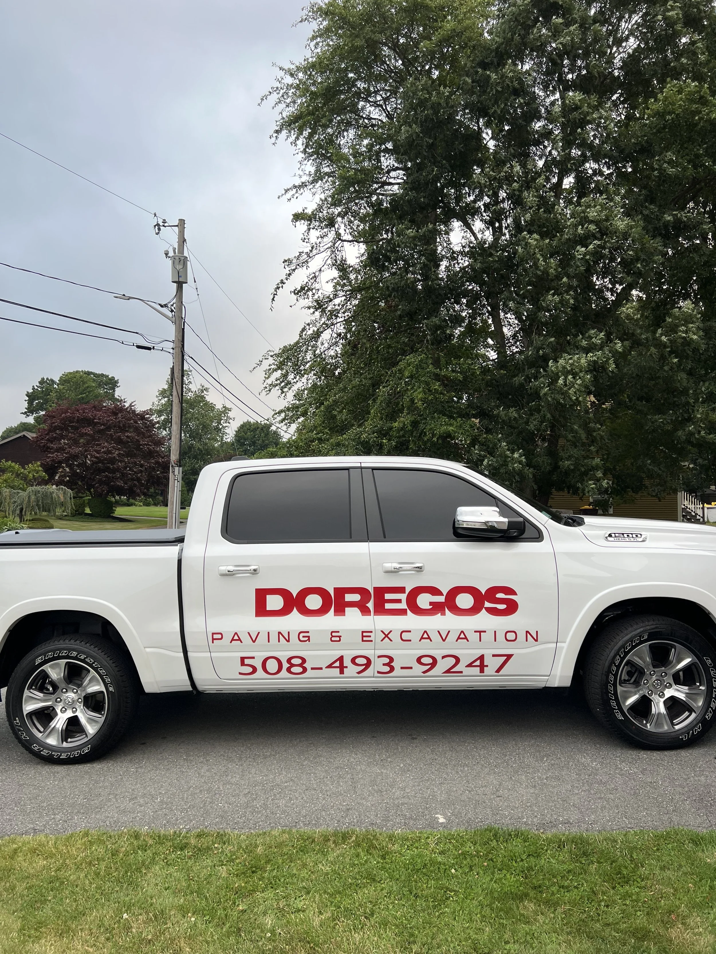 Beautiful Looking Pick up completed for Doregos Paving & Excavation out of Fall River, MA.  The bright red vinyl popped so well off the clean white paint job.