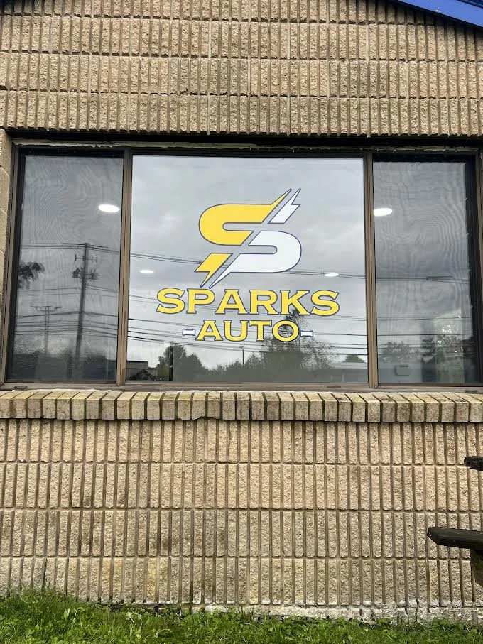 Street Side Glass Window For Sparks Auto.
