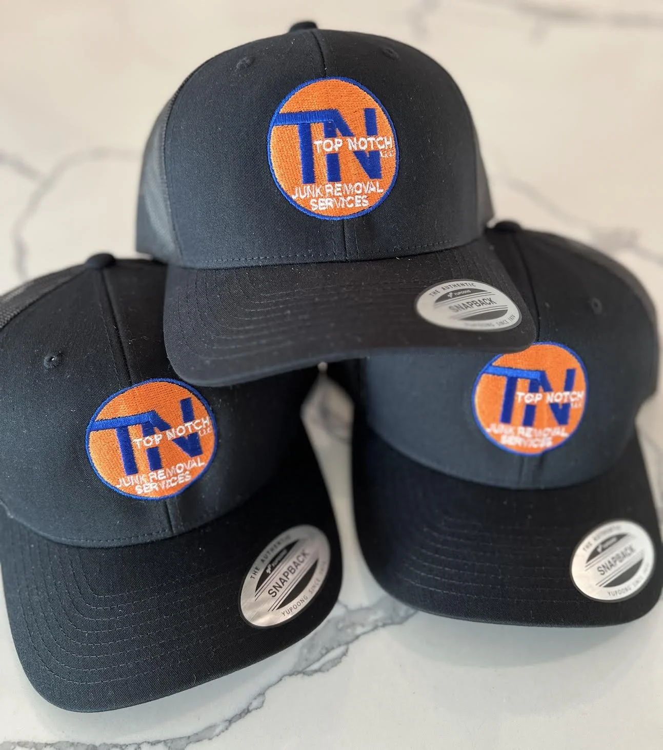 Custom Apparel; Embroidered Hats for Top Notch Removals