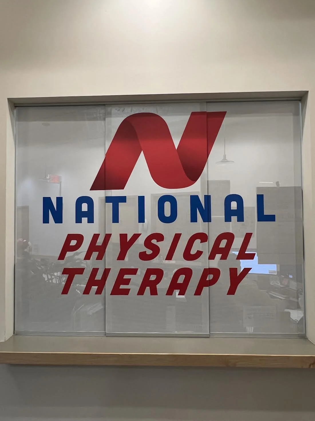Interior Sliding Glass Privacy Perforated & Branded for National Physical Therapy out of Fall River, MA.