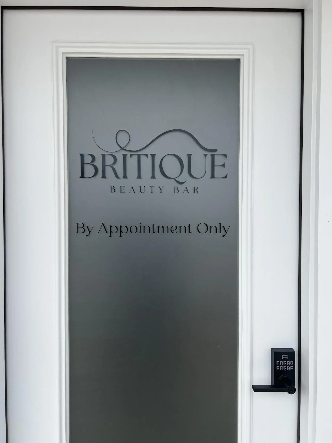 Entrance Door for Britique's newest salon in Dartmouth, MA.  Project complete with full coverage 3m Dusted Crystal with logo Installed with Black High Performance Vinyl.