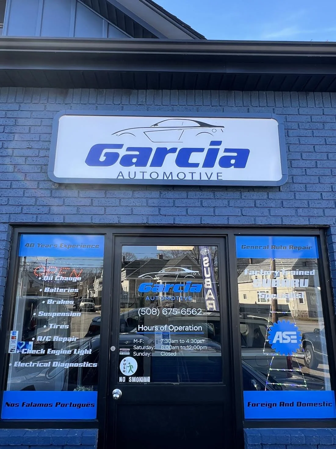 Storefront 15% Solargard Architectural Tint & Branding for Garcia Automotive in Fall River, MA.