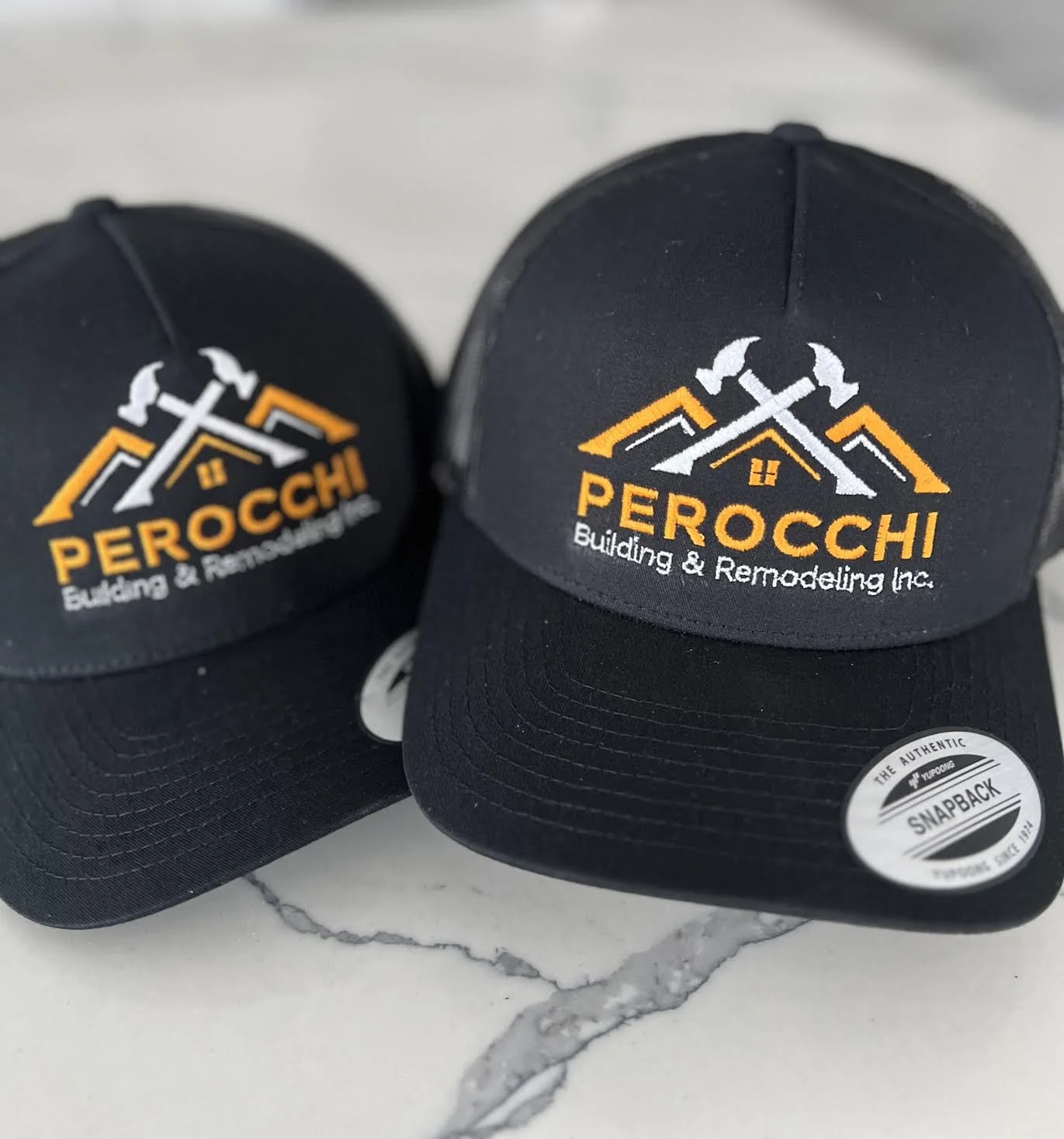 Embroidered Snapbacks for Perocchi Building & Remodeling located in Plymouth, MA