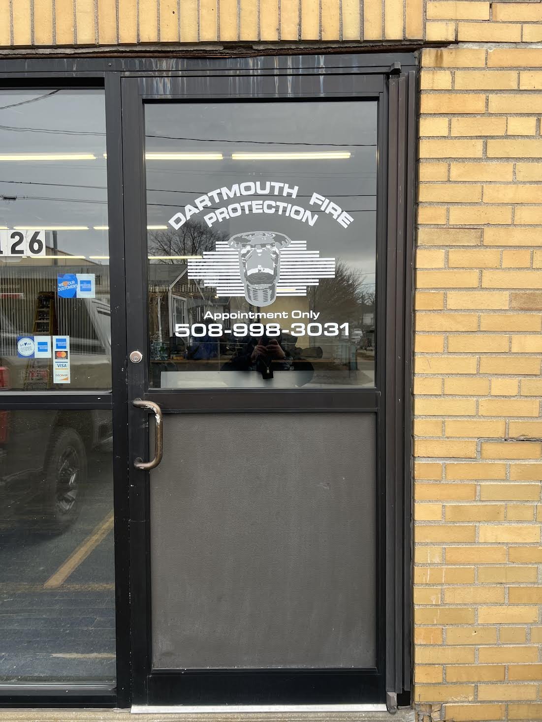 Storefront Entrance Door Branded for Dartmouth Fire Protection out of New Bedford, MA!