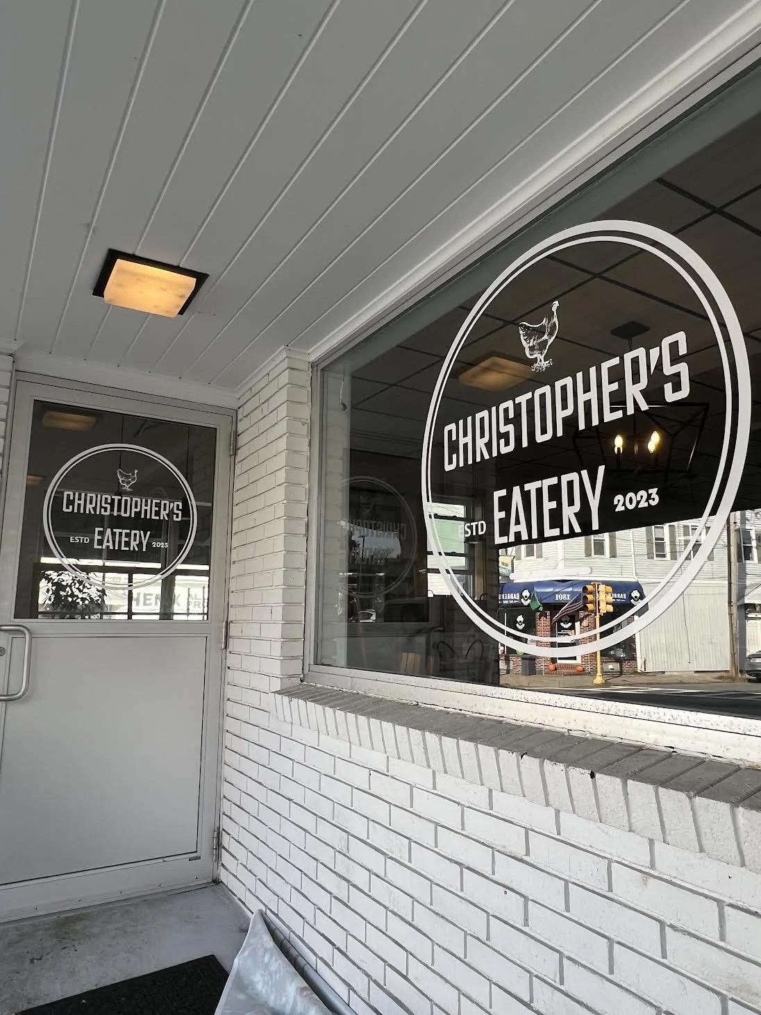 Some classy White High Performance Vinyl Installed on 1 Entrance door and 1 Large Side window for Christopher's in Fall River, MA!