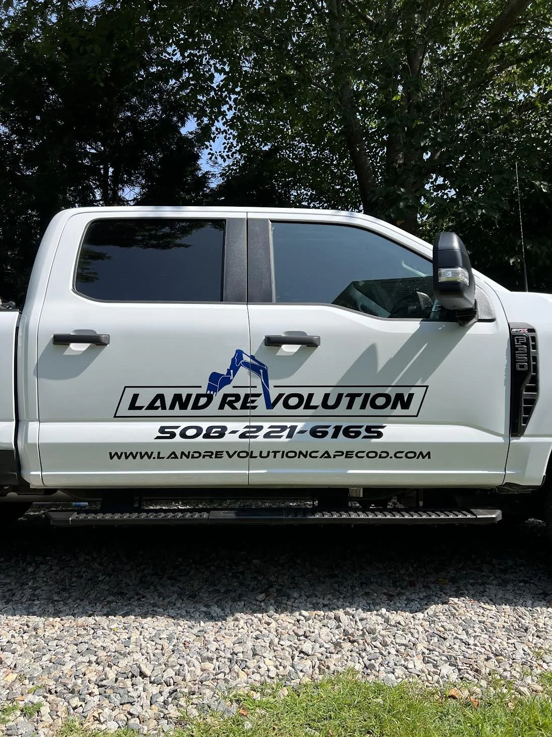 Another Vehicle Branding Project with Land Revolutions Linear logo spanning across both Doors!