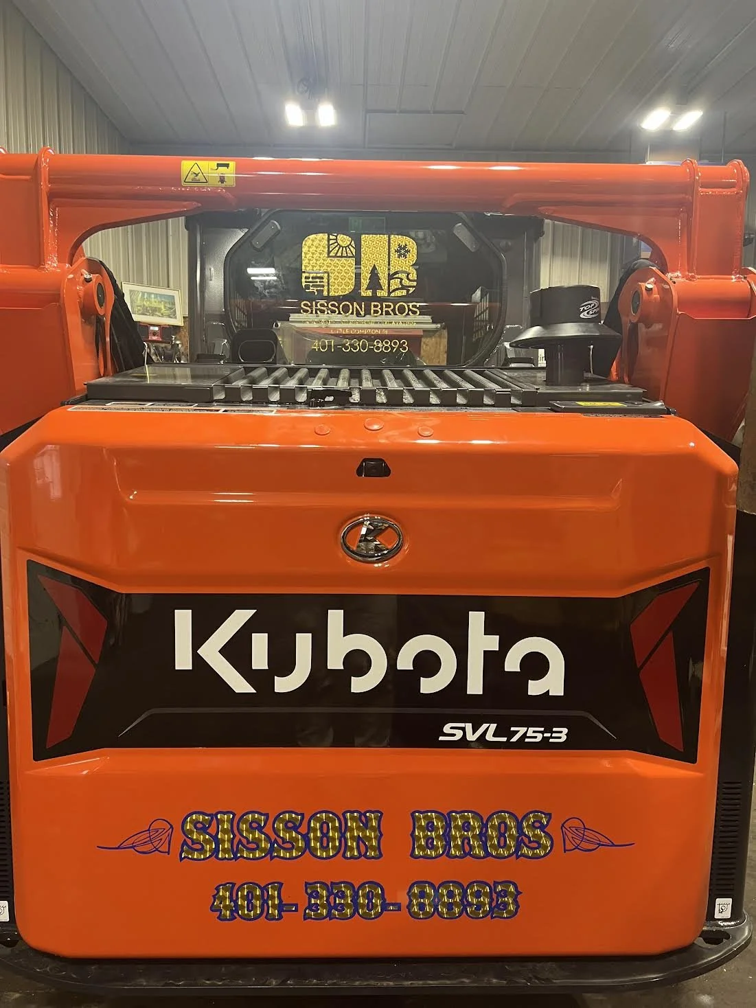 Gold Engine Turn Branding with a Blue outline effect for Sisson Bros out of Westport, MA.