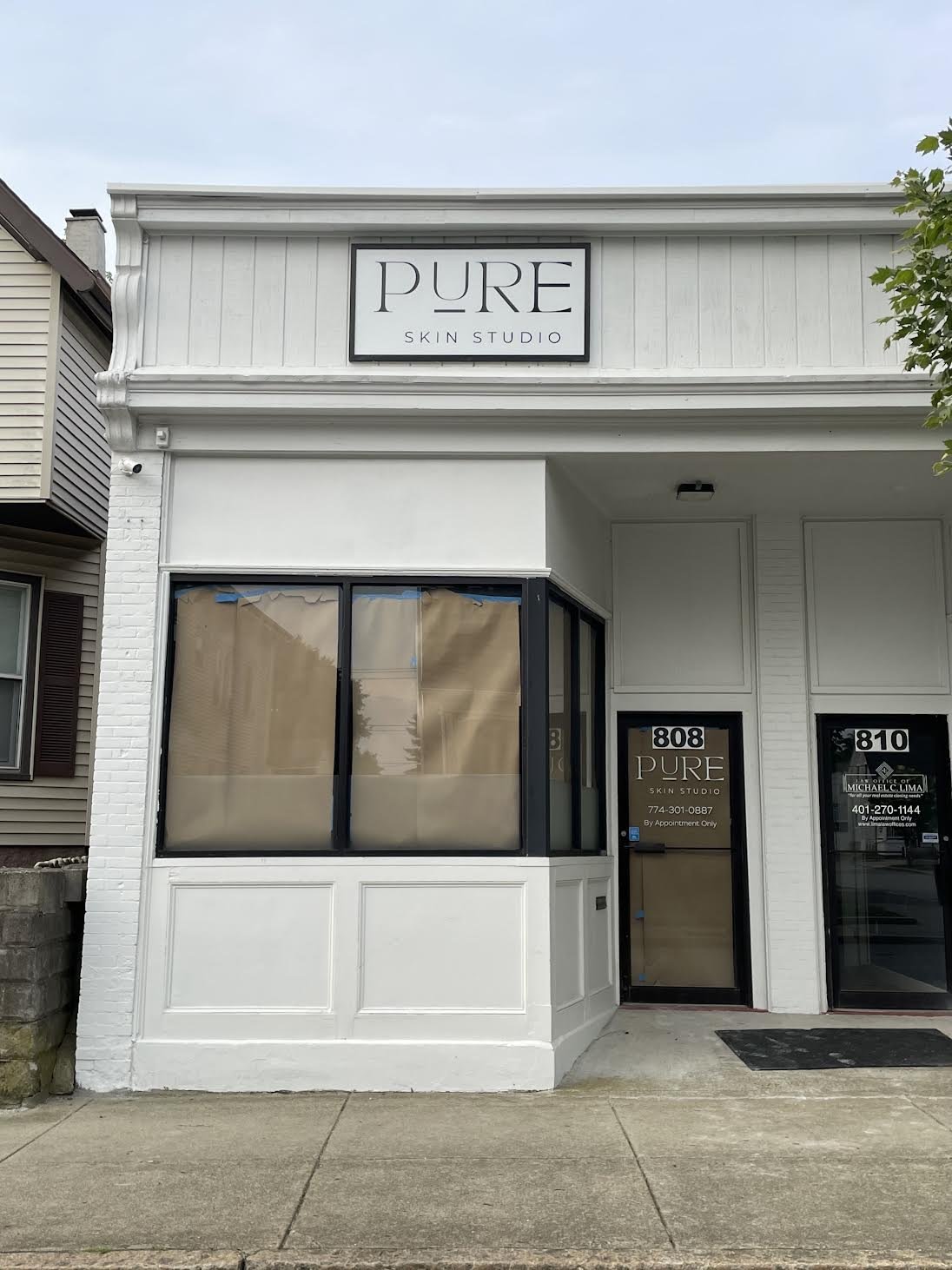 Storefront complete for Pure Skin Studio located in New Bedford, MA.  Entrance Door Vinyl, Frosted 18" Privacy Strips & new Building Sign Face!