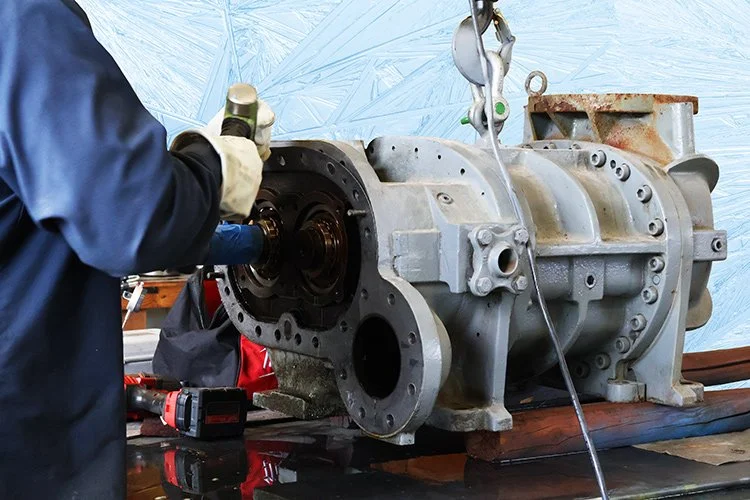 Rebuilding a compressor for industrial refrigeration.