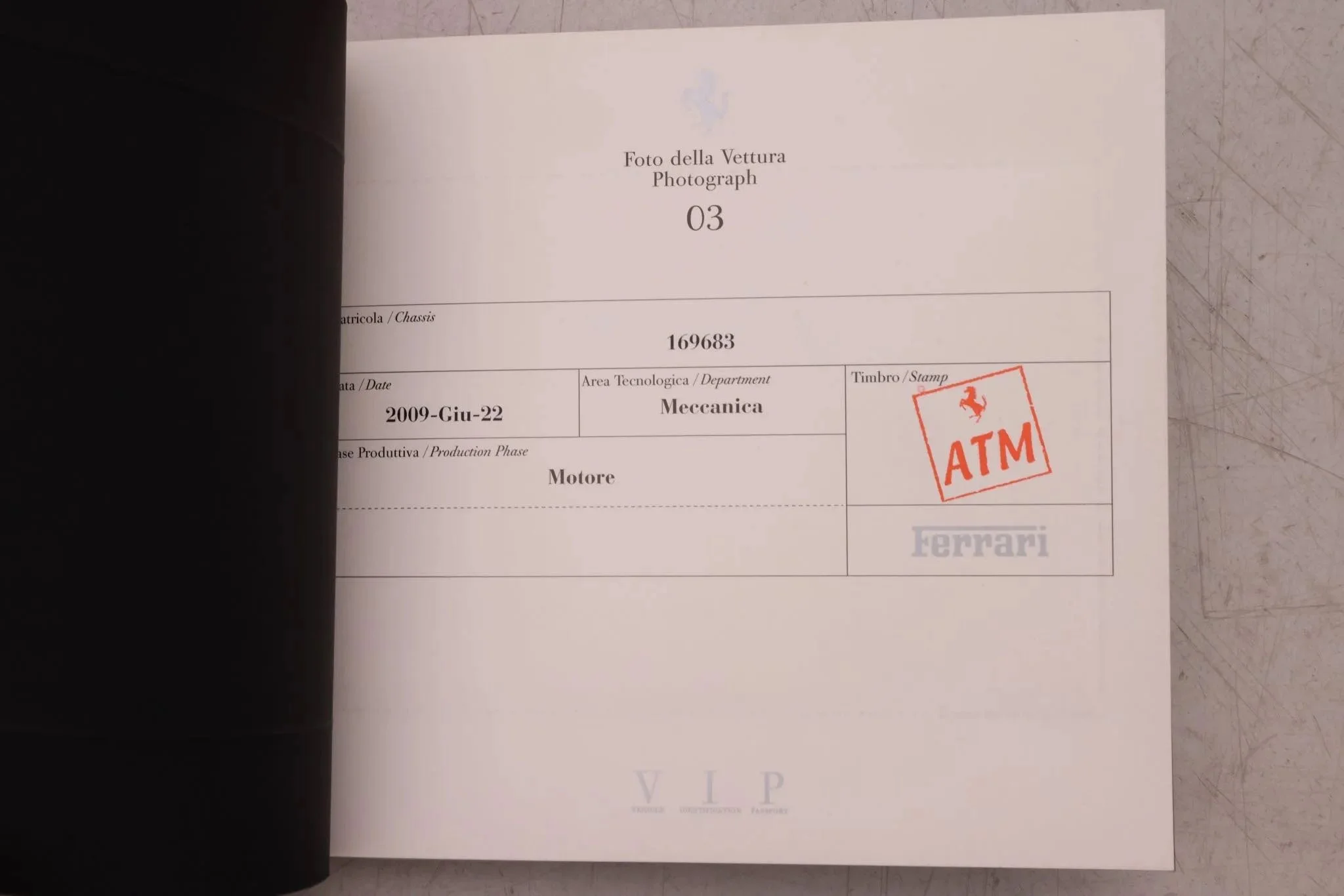 Page from a vehicle document with details including the date, department, chassis, and a red Ferrari stamp.