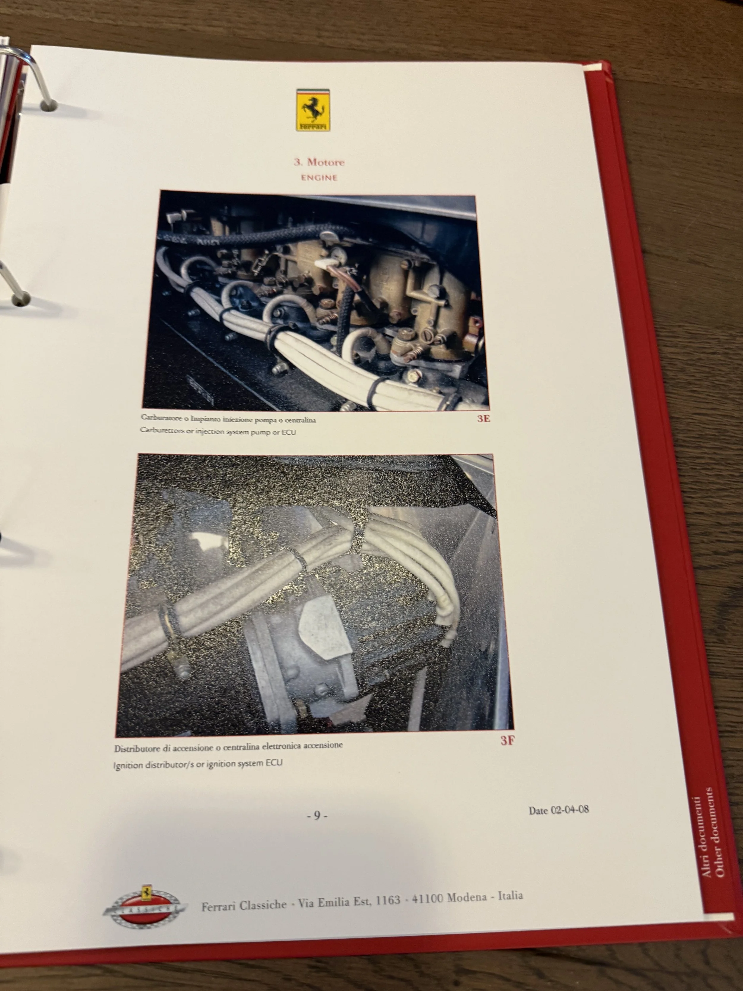 Photograph of a Ferrari service manual page showing images and descriptions of the engine's injection pump and ECU ignition distributor system.