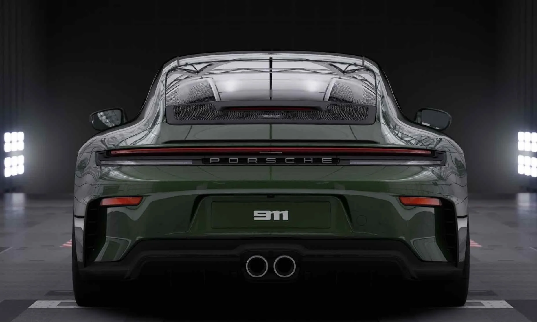 Rear view of a green Porsche 911 with two exhaust pipes and a black license plate with '911' in white, in an indoor setting with spotlights.