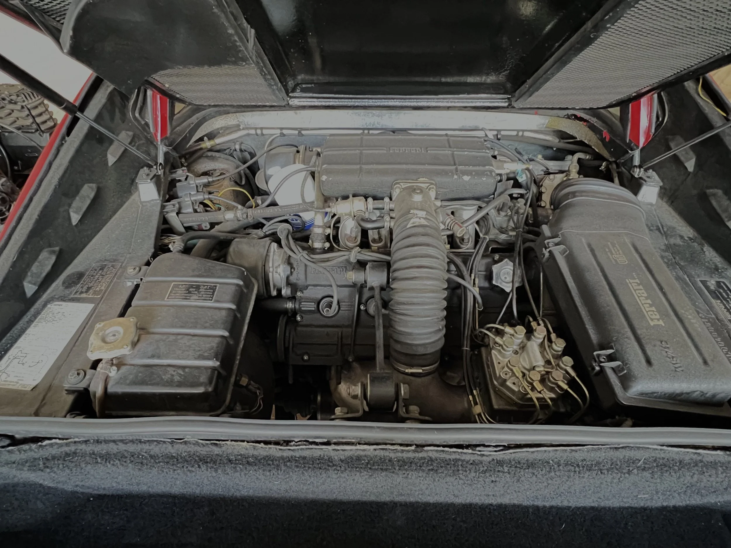 Interior view of a car engine in an engine bay.
