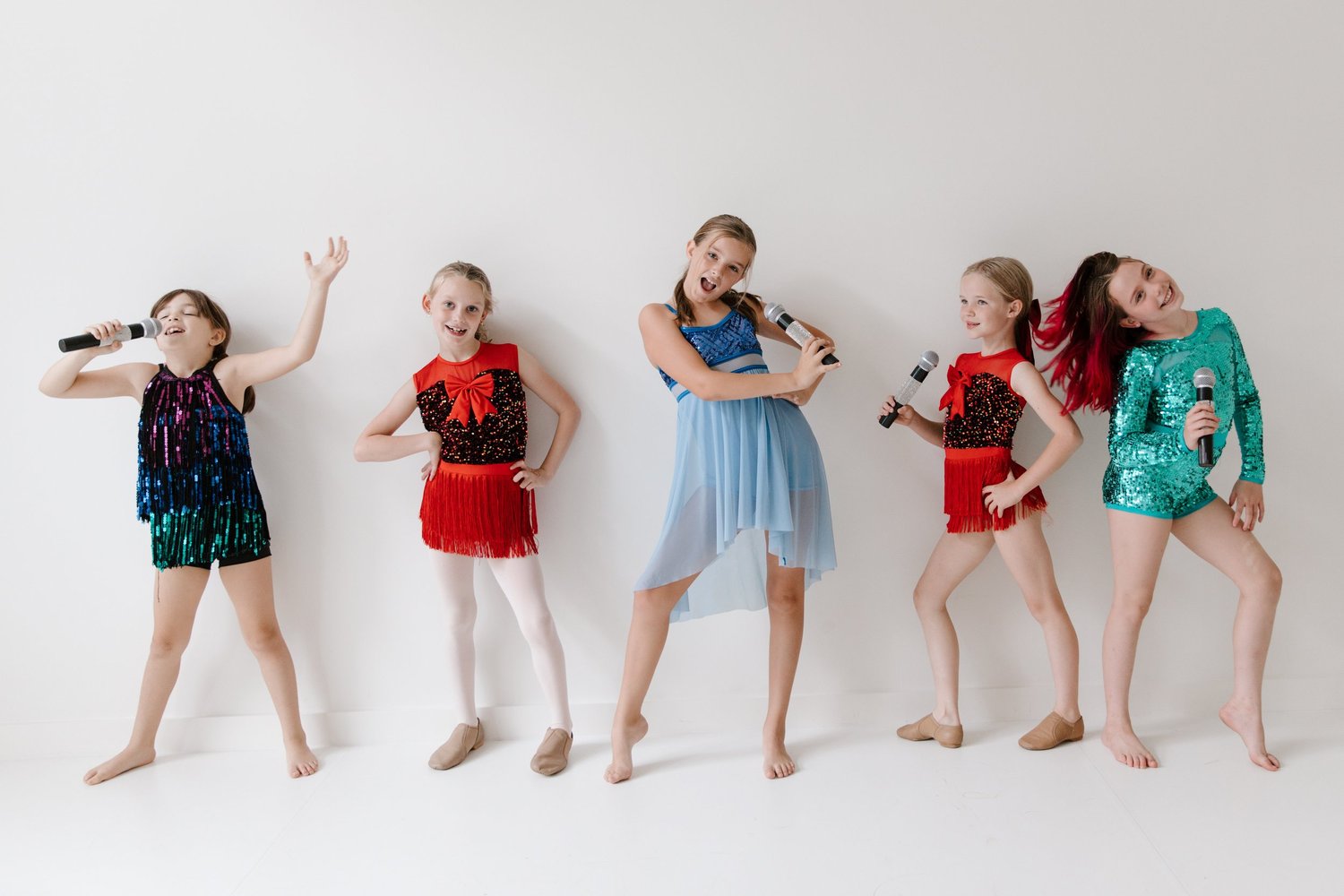 Kids with microphone props at a Superstar Dance Party