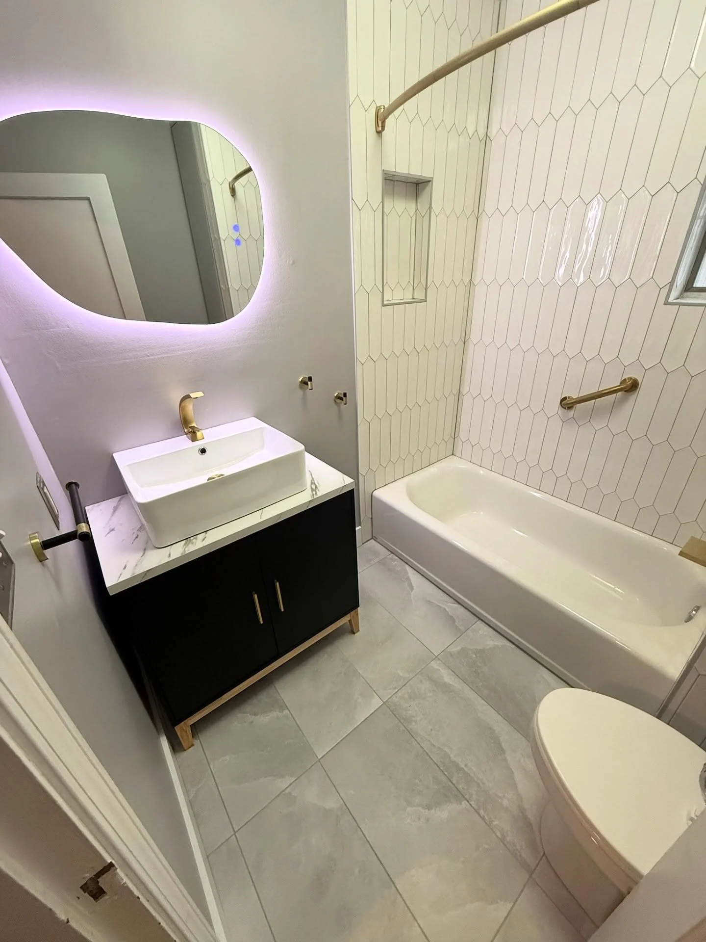 Double Bathroom Reno &mdash; the first bathroom got an upgrade with new tile tub surround, niche, tile floor, and vanity with touch screen mirror.

The master bath got a full makeover with new tile in shower, large custom niche, tile floor, and vanit