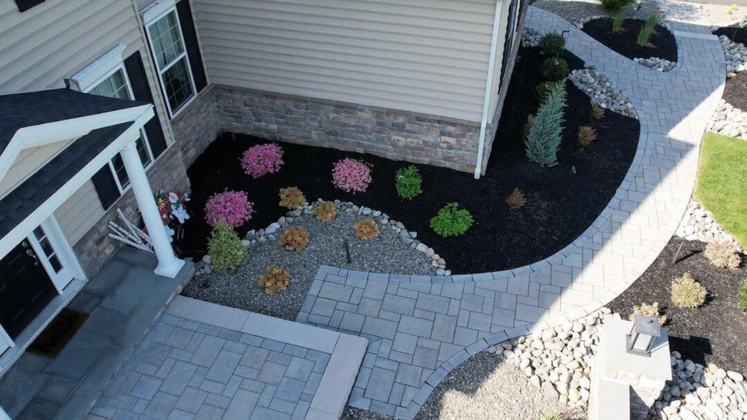 Elegant walkway installed alongside beautiful plantings. #kansascity #leawood #lenexa #kc #kcmo #olathe #leessummit #grainvalleymo #kclandscaping #kchomes #kcrealestate #kcrealtor