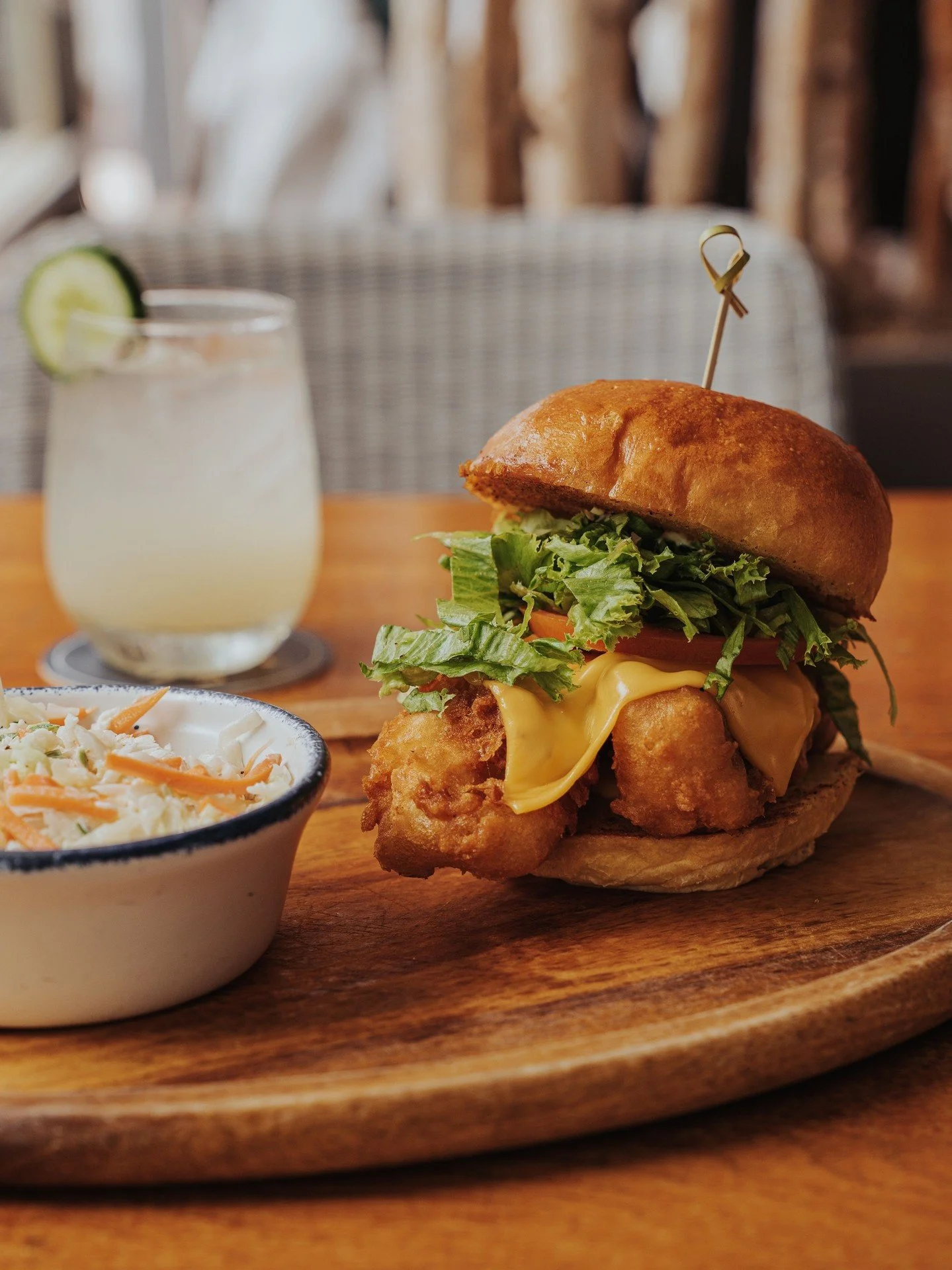It's officially fall, but we're still craving this. ⁠
⁠
CRISPY COD FISH SANDWICH ⁠
american cheese, lettuce, tomato, tartar sauce, fries, lakehouse slaw