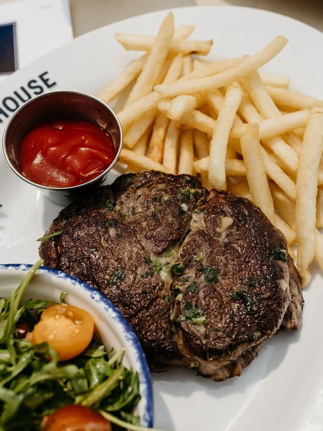 THE DUKE RIBEYE⁠
seared ribeye, compound butter, arugula &amp; tomato salad