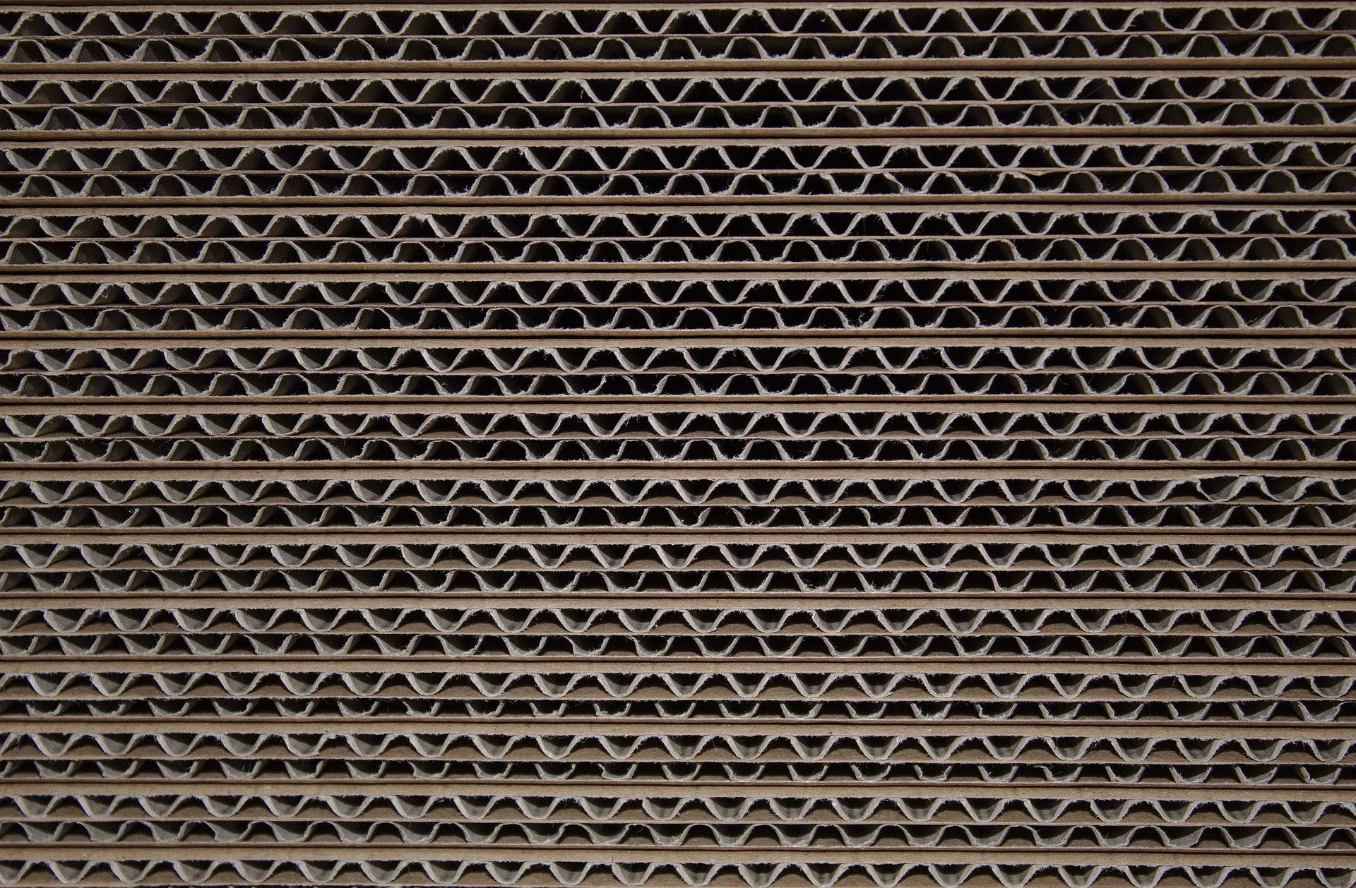 Close-up of stacked corrugated sheets showing the fluted structure.