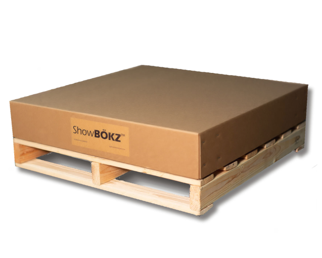 Corrugated BÖKZ™ shipping container collapsed with side panels folded inside the bottom tray and the lid placed on top.