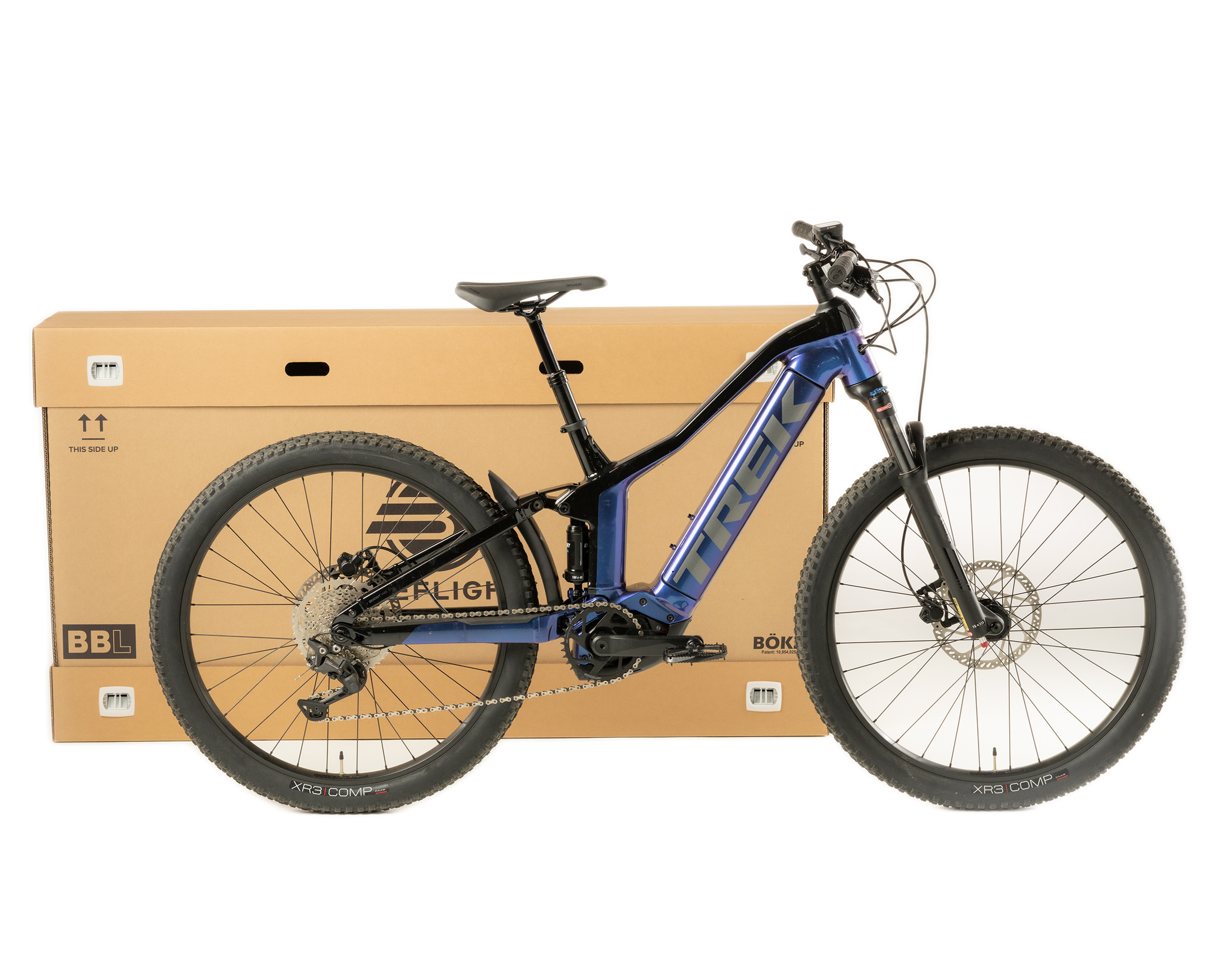 Assembled corrugated BikeBÖKZ™ shipping container with a bicycle positioned in front.