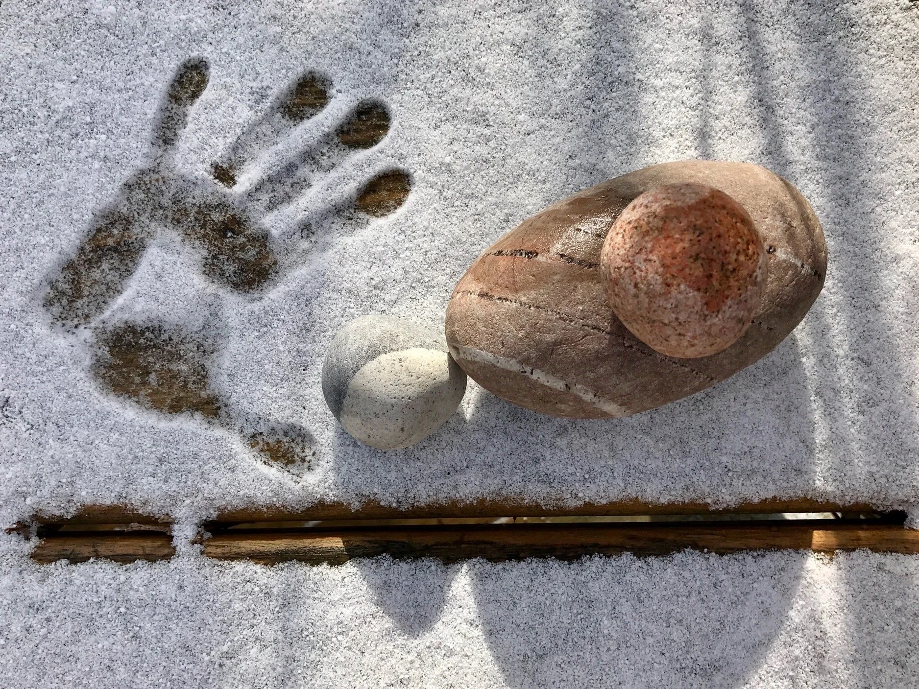 Stones w snow hand.JPG