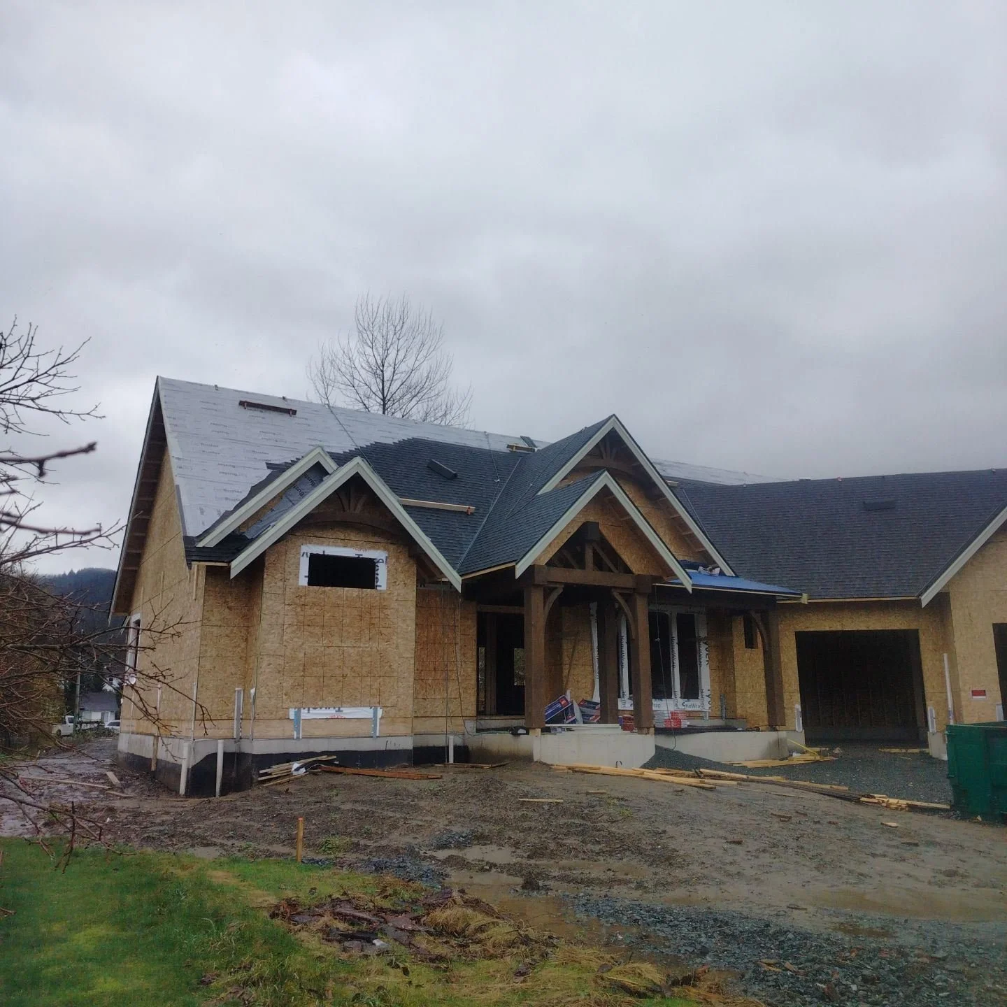 New construction residential roof installation in progress on custom home in Chilliwack, BC
