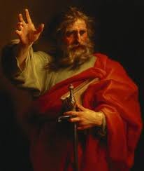 A painting of a man with a beard and long hair, wearing a red robe, holding a sword in one hand, and raising the other hand in a blessing gesture.