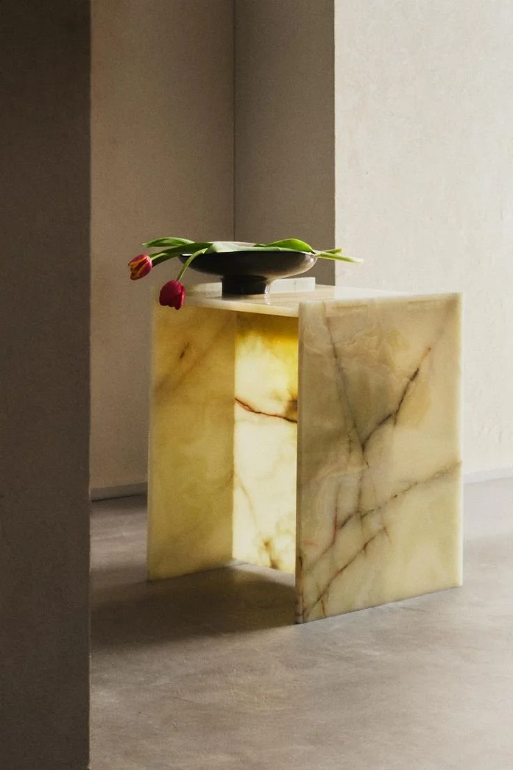 onyx stone table in microcement room