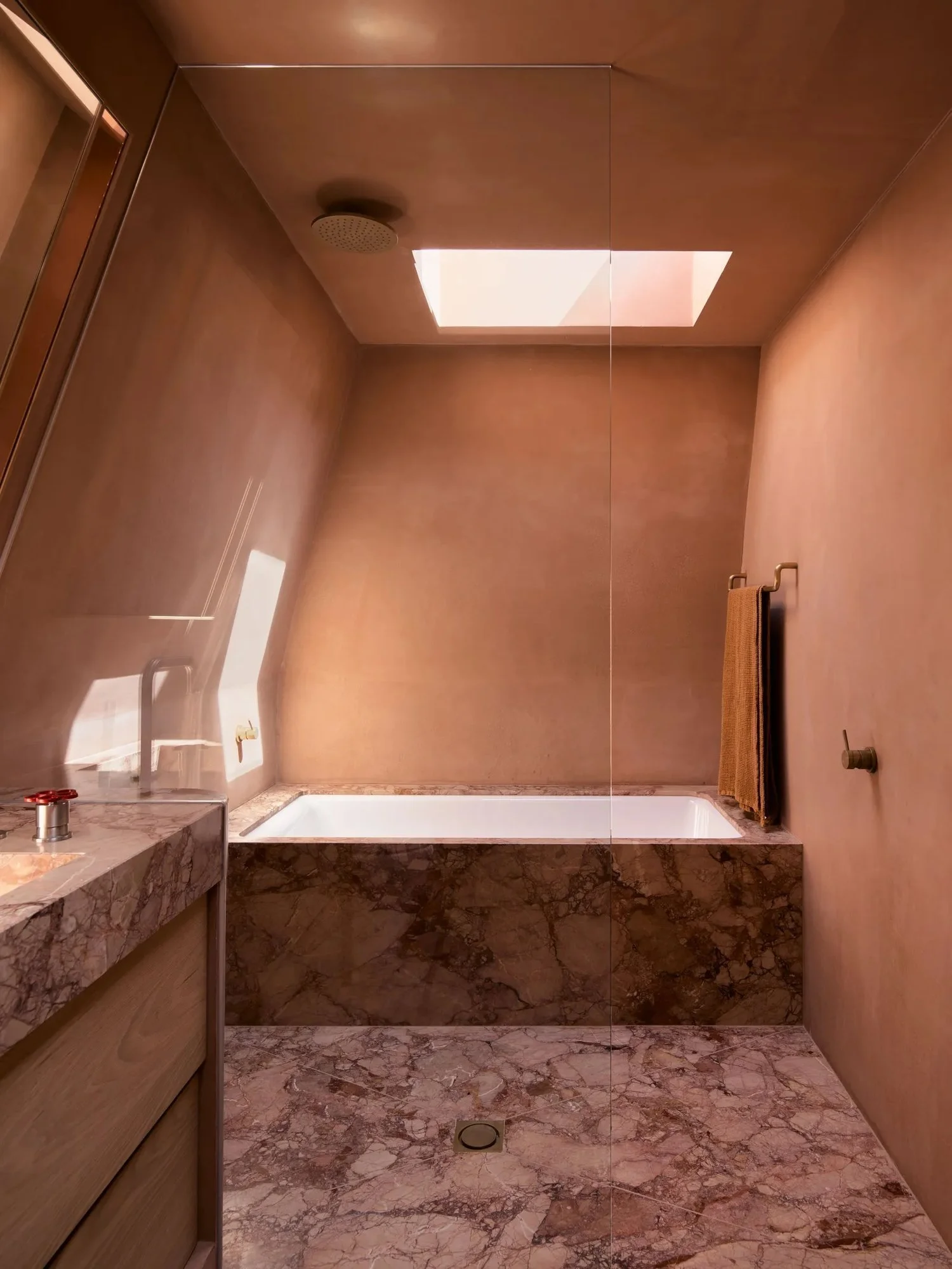 pink bathroom with microcement walls