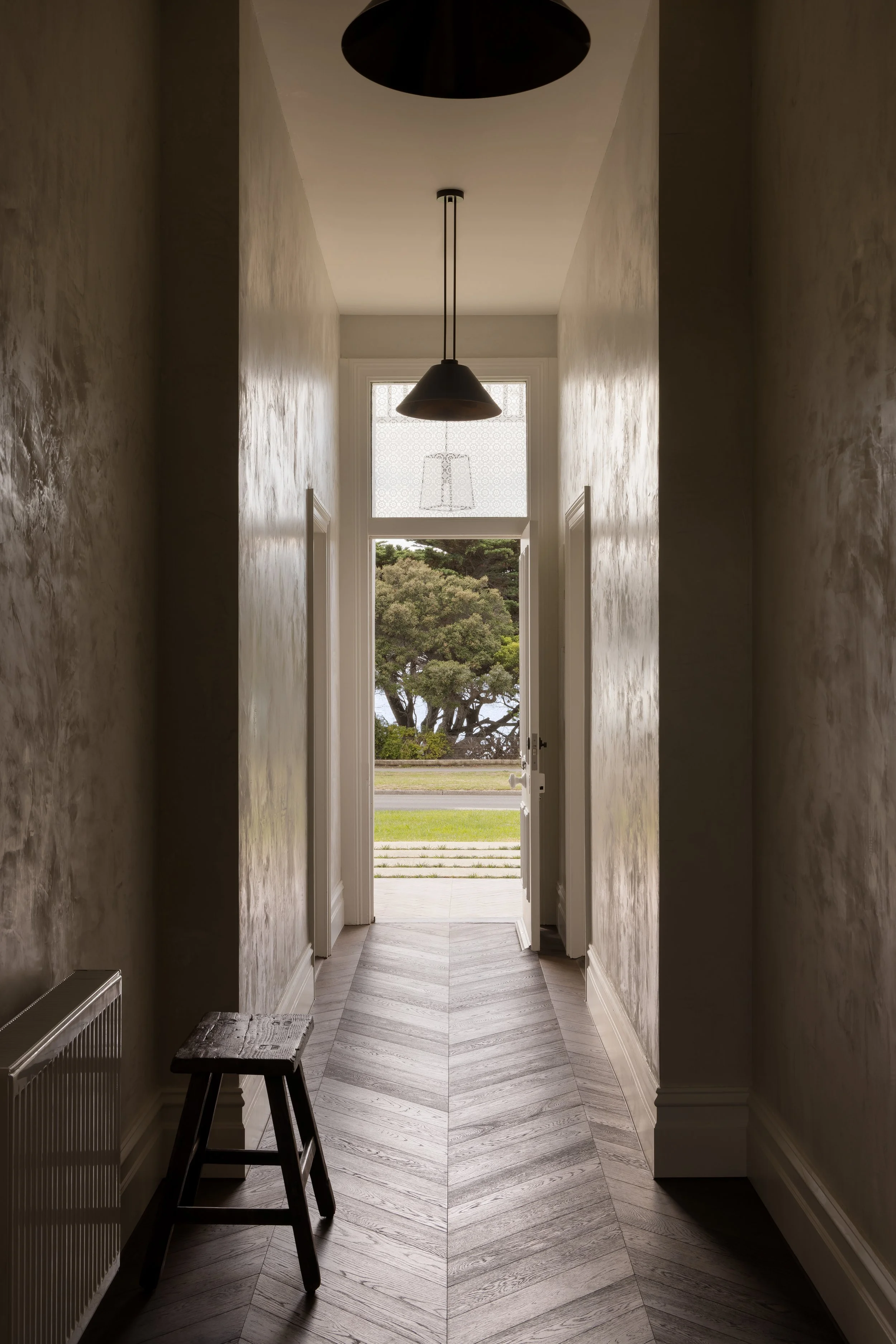 entryway with herringbone oak
