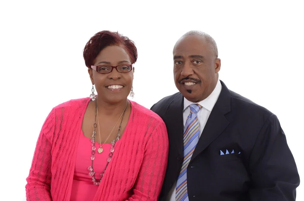 Photo of Bishop Thomas in a black suit and Lady Marva in a pink sweater.