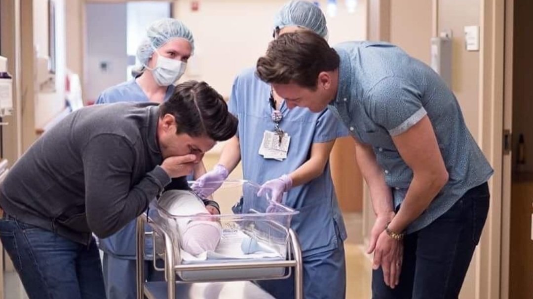 Hive CEO & Founder, Byron Slosar, and husband seeing their newborn baby for the first time