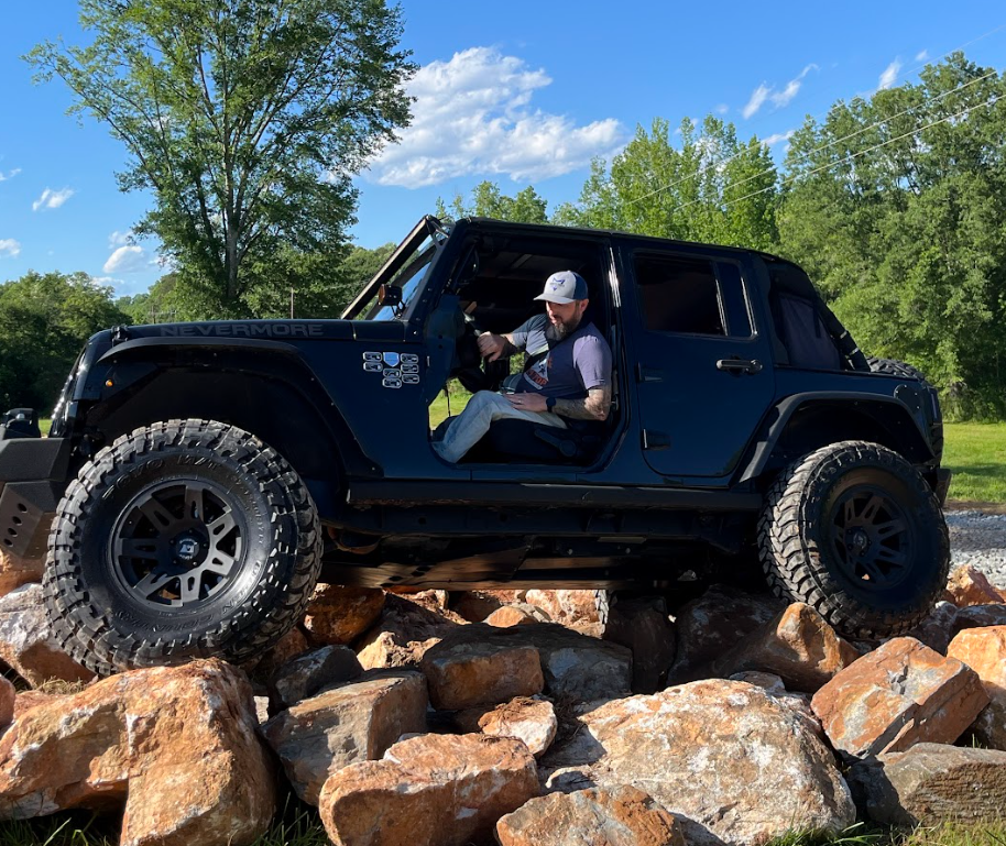 Jeep navigating the rocky course at the F.A.R.M. Center