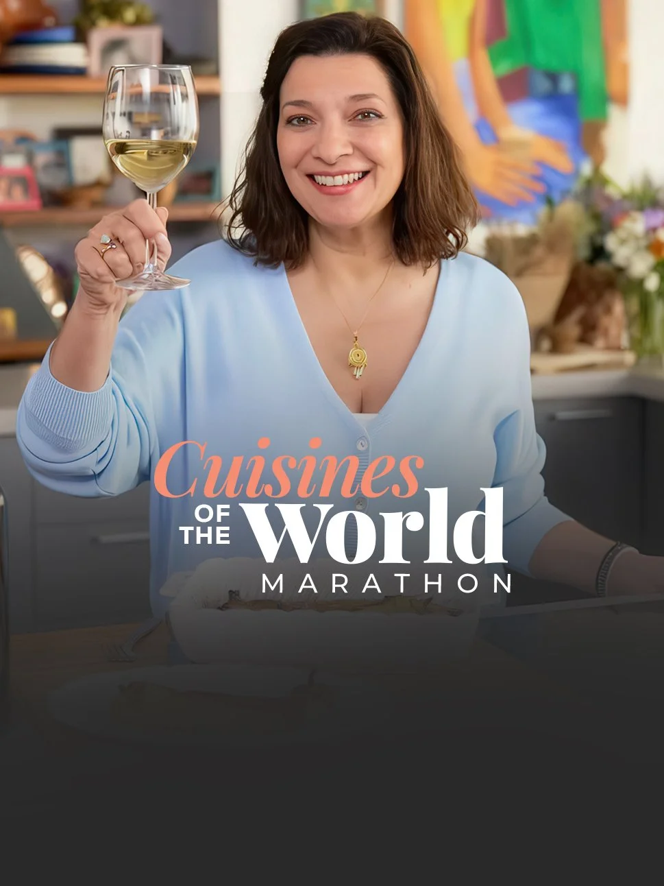 Diane Kochilas holding a glass of white wine