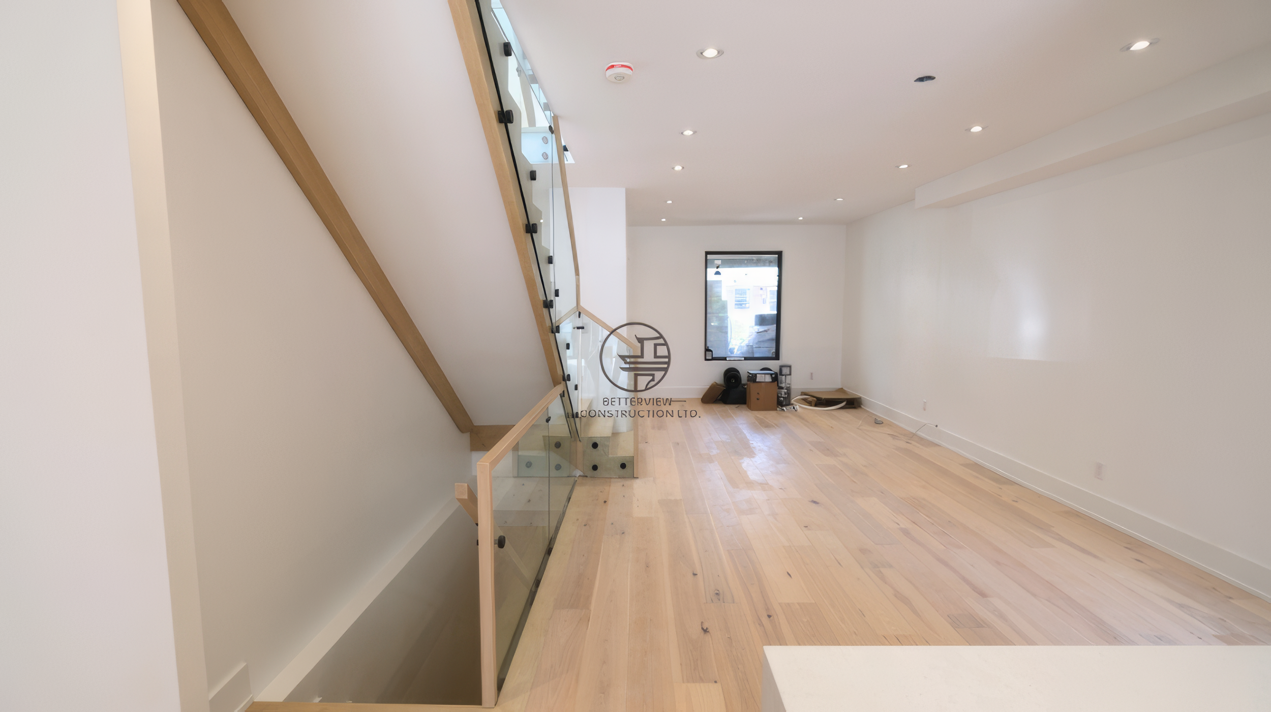 toronto-modern-interior-glass-staircase-hardwood-flooring.jp.png