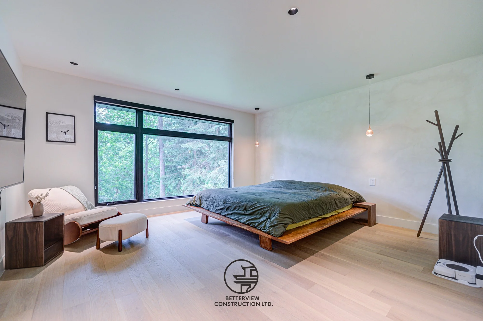 modern master bedroom with large window and minimalist design after home renovation