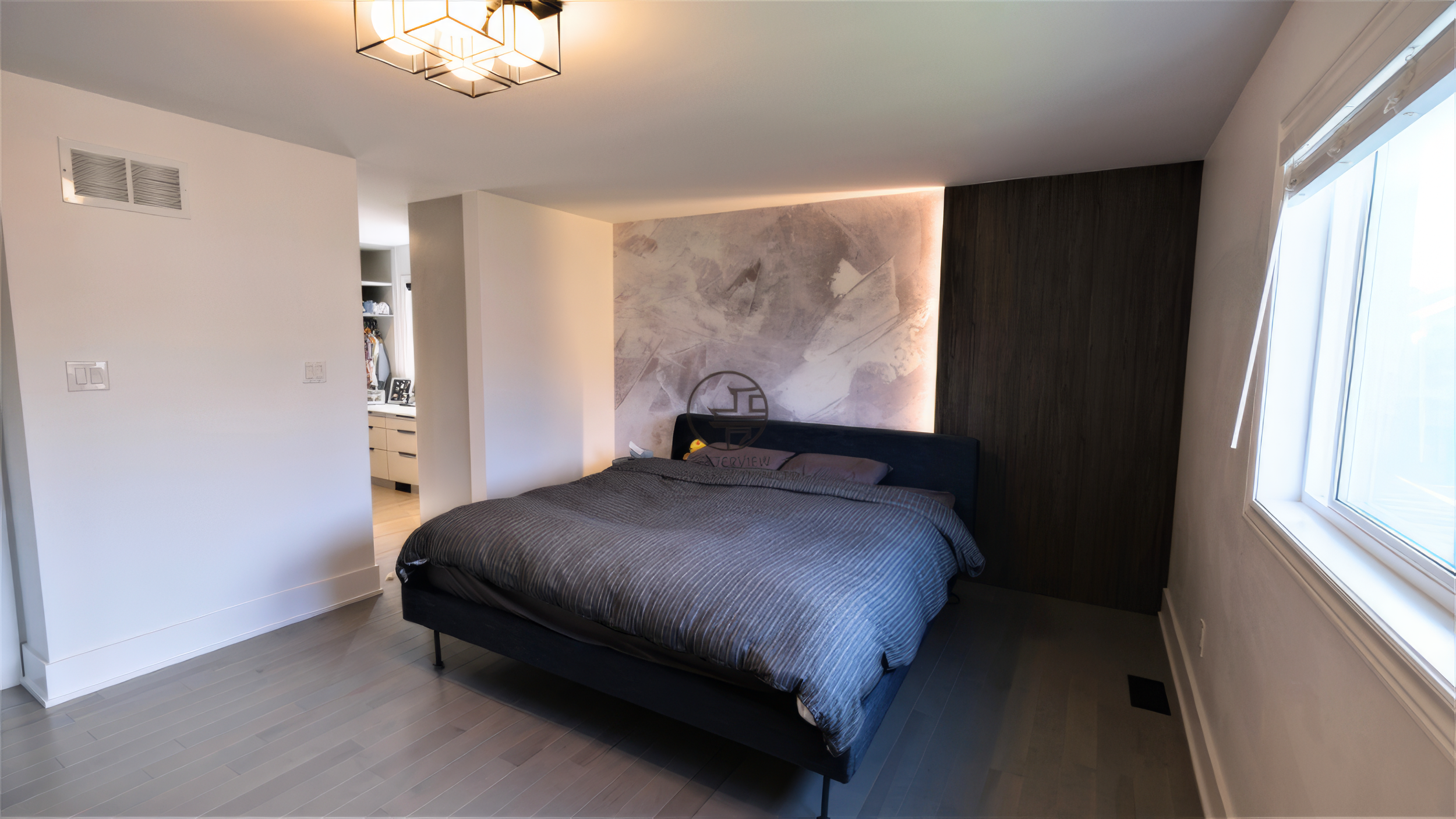 modern bedroom design with accent wall and contemporary lighting
