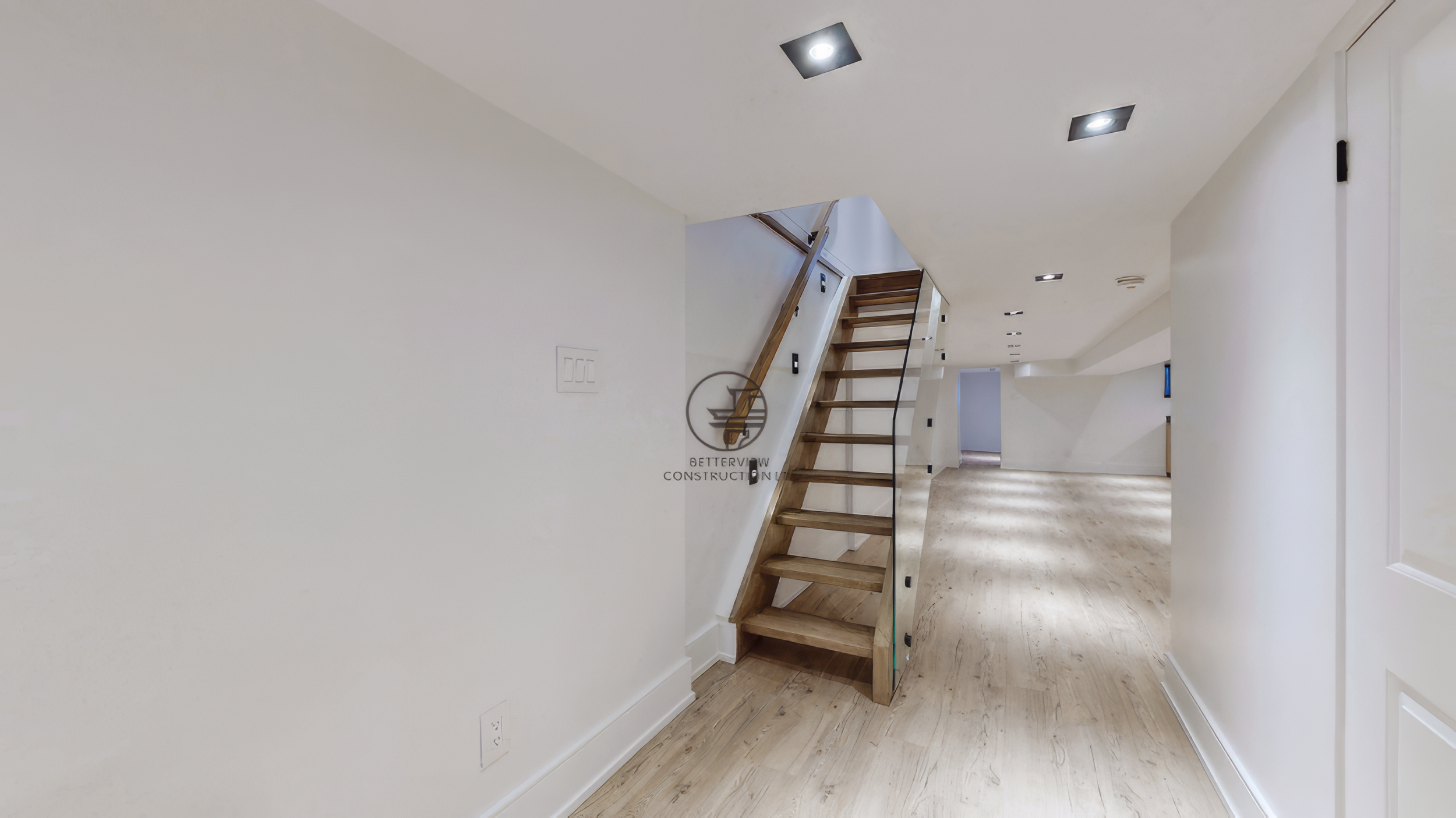 modern-basement-staircase-with-glass-railing-and-wood-steps.jpg.png